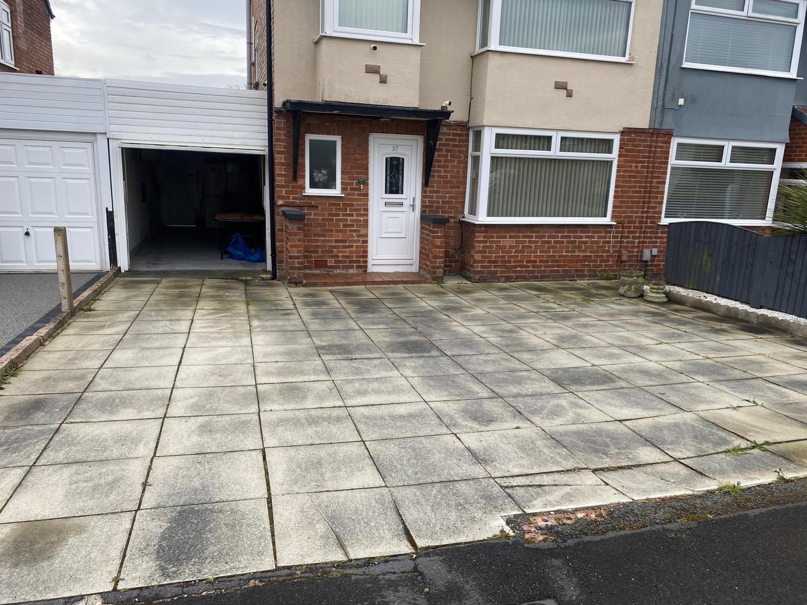 Mossy old paving slabs before replacement